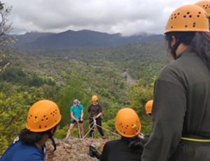 Students climbing down a hill