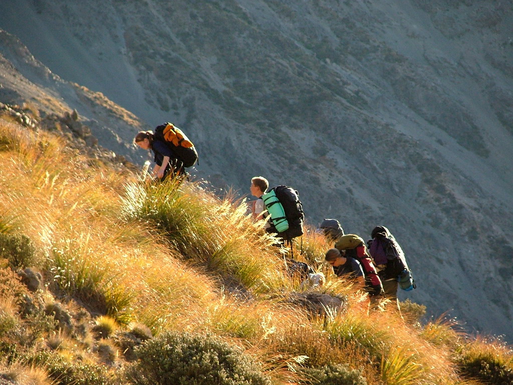 Project K students climbing up a hill