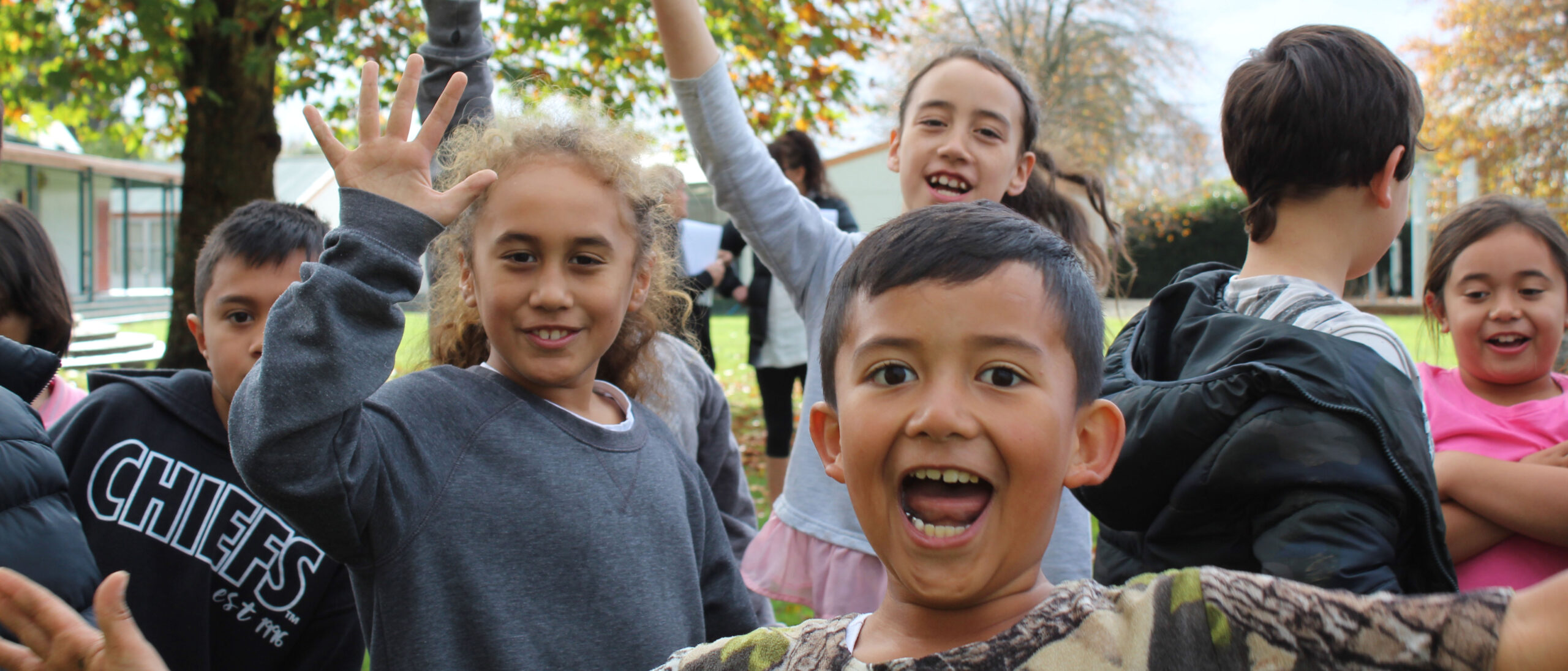 Kiwi Can Kids smiling at camera