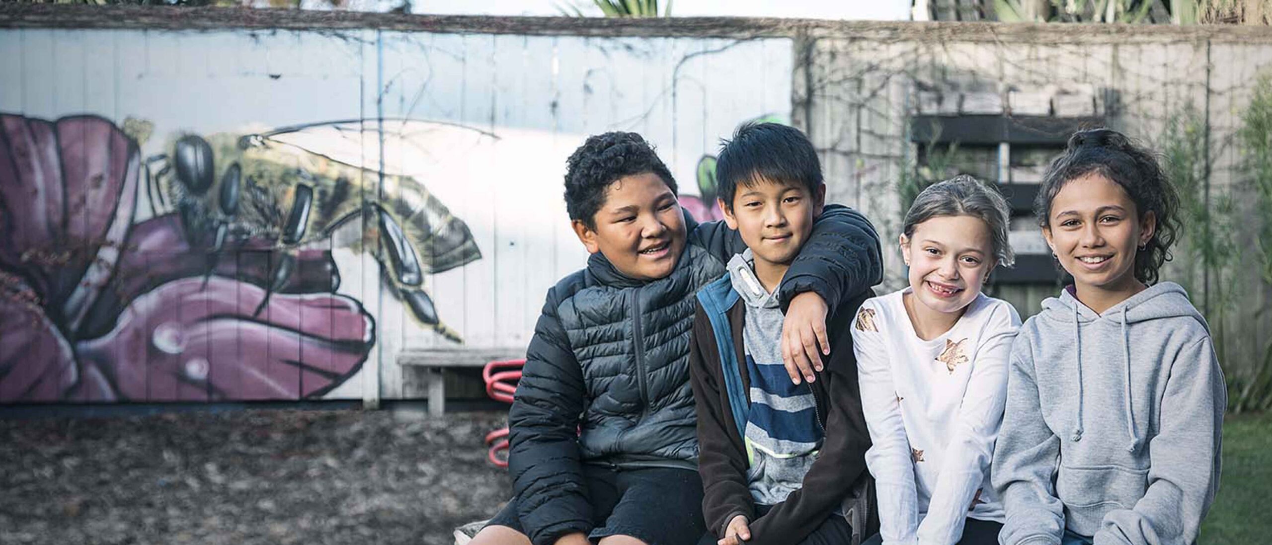 students sitting on bench