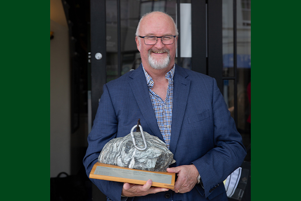 Ted Culley holding award